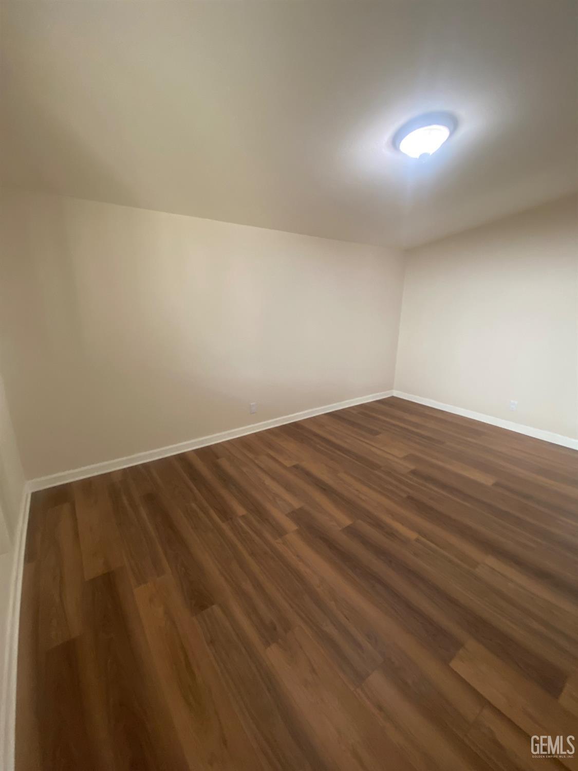 Undisclosed Address Santa Ana, CA 92707 - Photo 36 of 40 a view of room with wooden floor