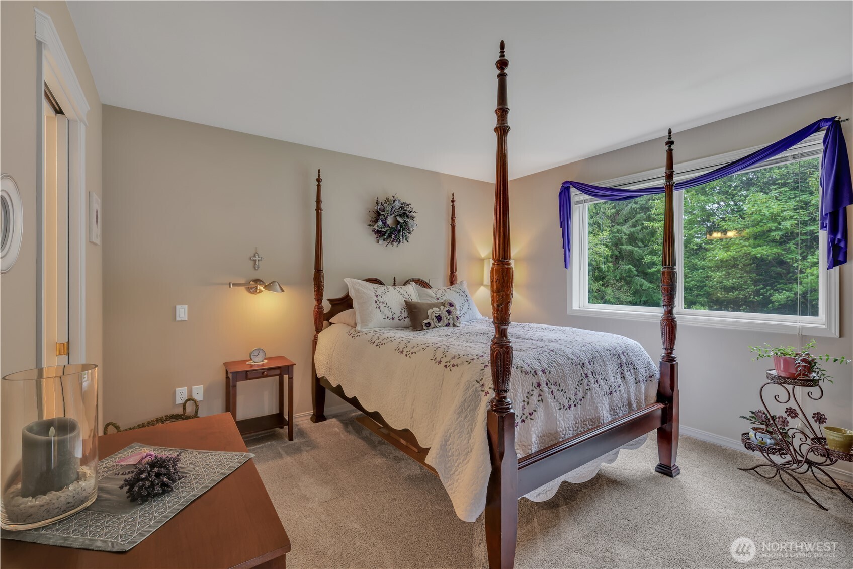 103 Southeast Alder Manor Road Shelton, WA 98584 - Photo 14 of 39 a spacious bedroom with a bed chandelier and a window