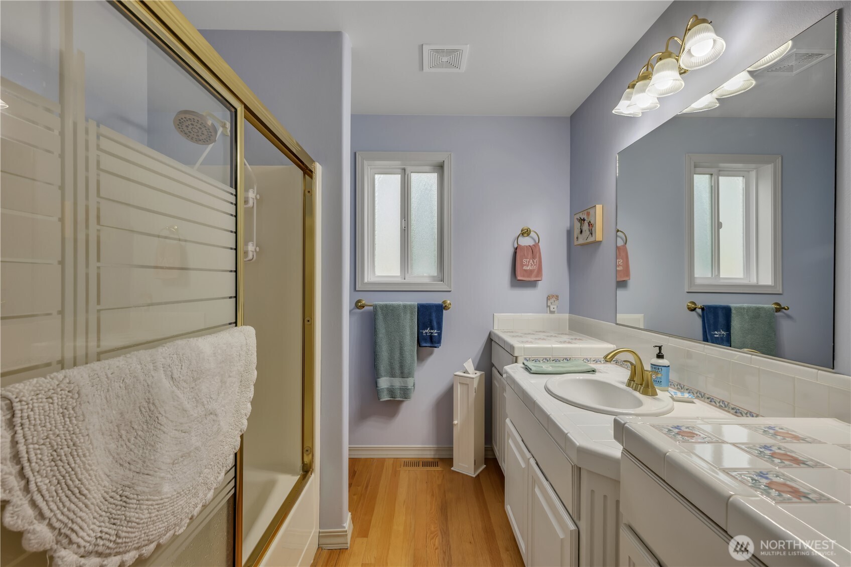 103 Southeast Alder Manor Road Shelton, WA 98584 - Photo 22 of 39 a bathroom with a sink a vanity and mirror