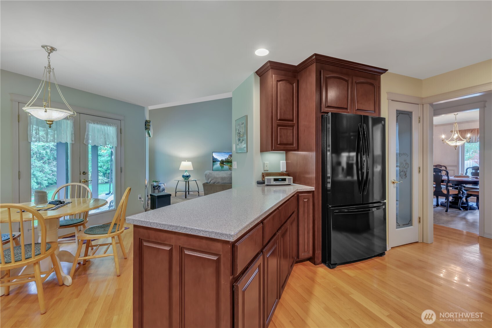 103 Southeast Alder Manor Road Shelton, WA 98584 - Photo 10 of 39 a kitchen with stainless steel appliances a refrigerator and a table