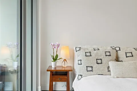 a bathroom with a bathtub sink and mirror