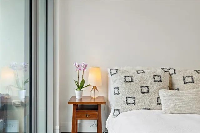 a bathroom with a bathtub sink and mirror