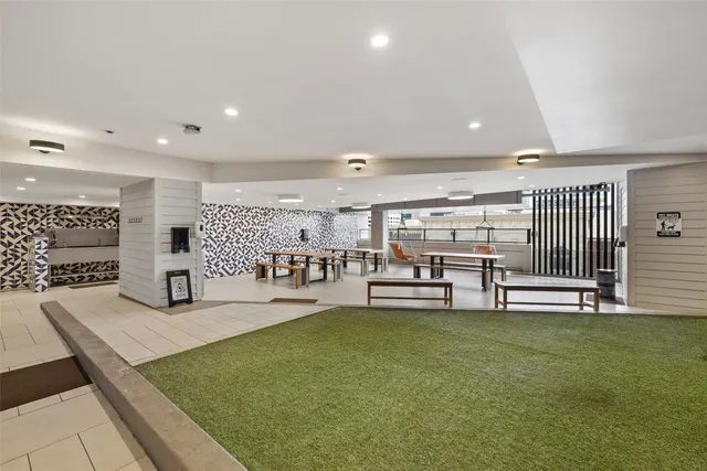 a living room with lots of furniture and a flat screen tv