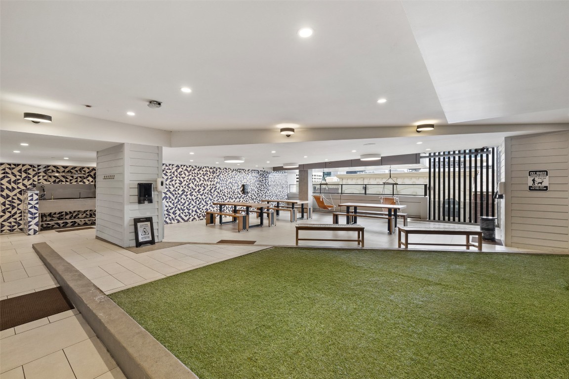 501 West Avenue, Unit 2202 Austin, TX 78701 - Photo 30 of 33 a living room with lots of furniture and a flat screen tv
