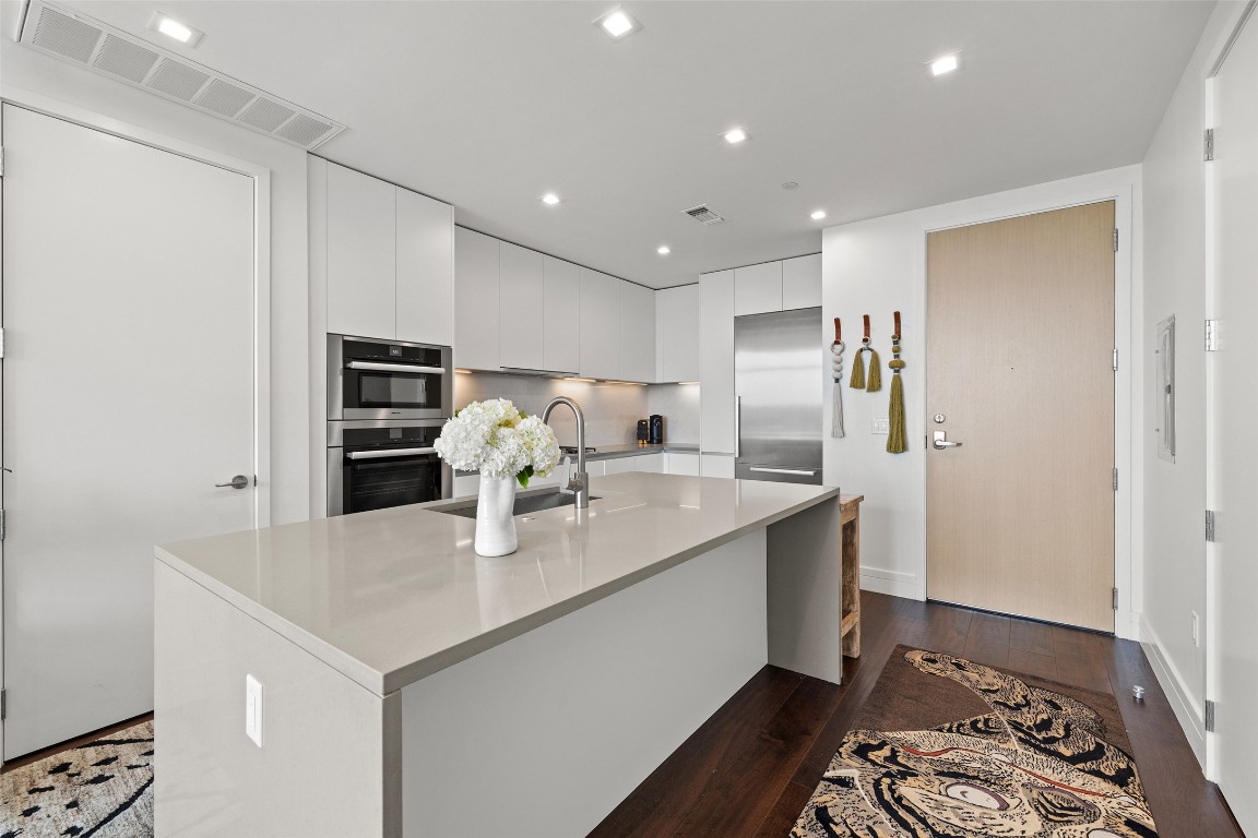 501 West Avenue, Unit 2202 Austin, TX 78701 - Photo 9 of 33 a kitchen with stainless steel appliances a sink and stove