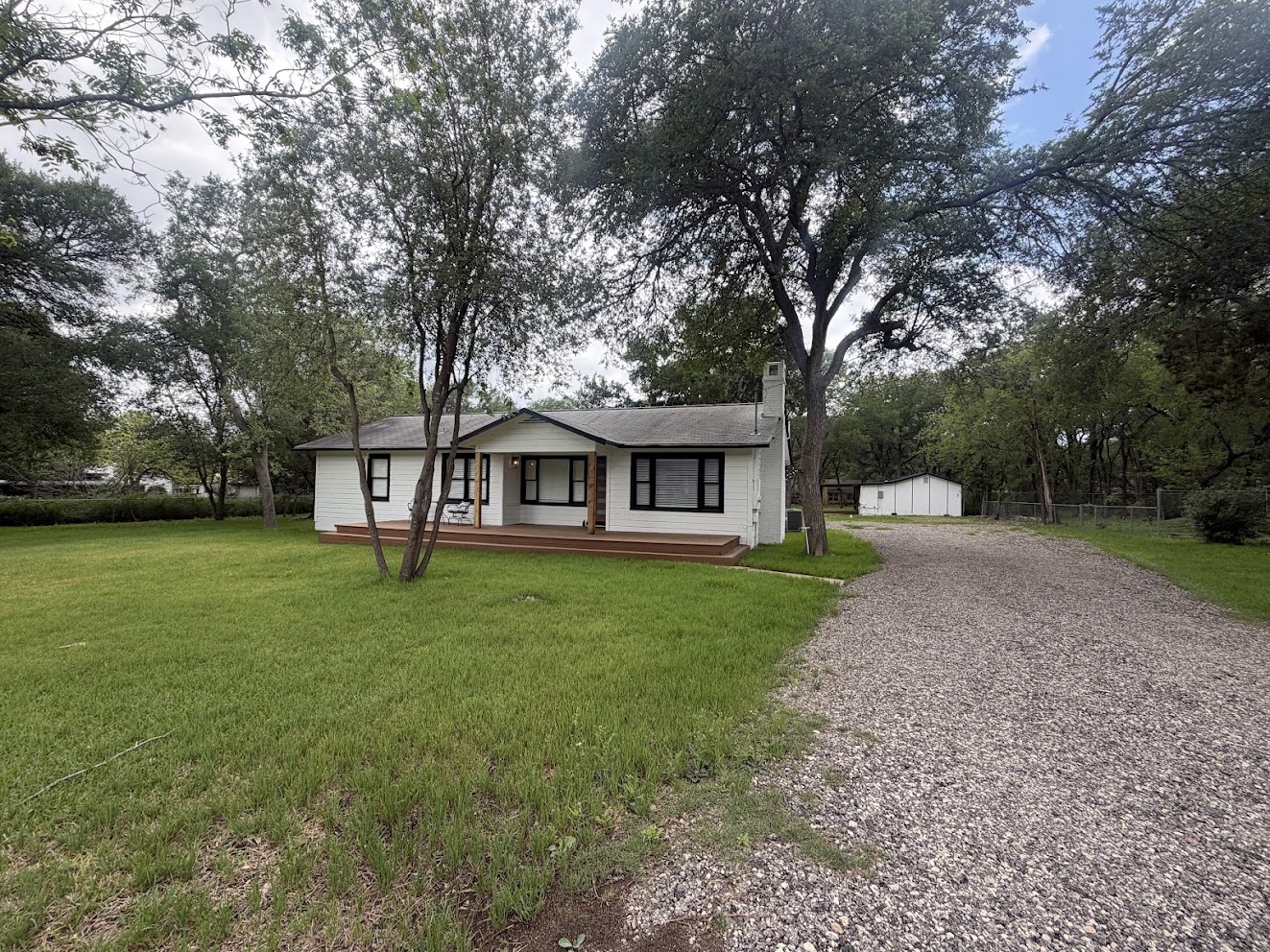8904 Chisholm Lane Austin, TX 78748 - Photo 2 of 40 White exterior with dark trim windows