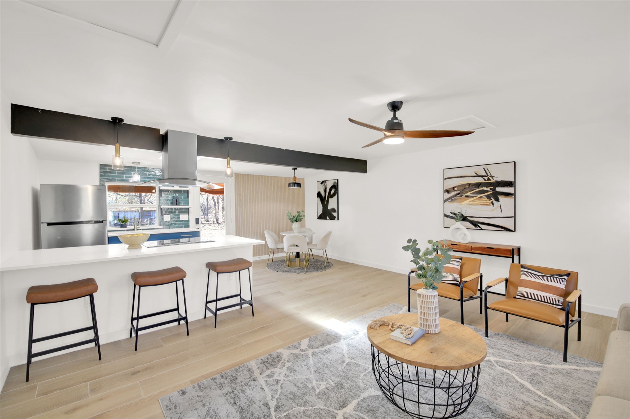8904 Chisholm Lane Austin, TX 78748 - Photo 23 of 40 Living area featuring light wood-style flooring, ceiling fan, and attic access