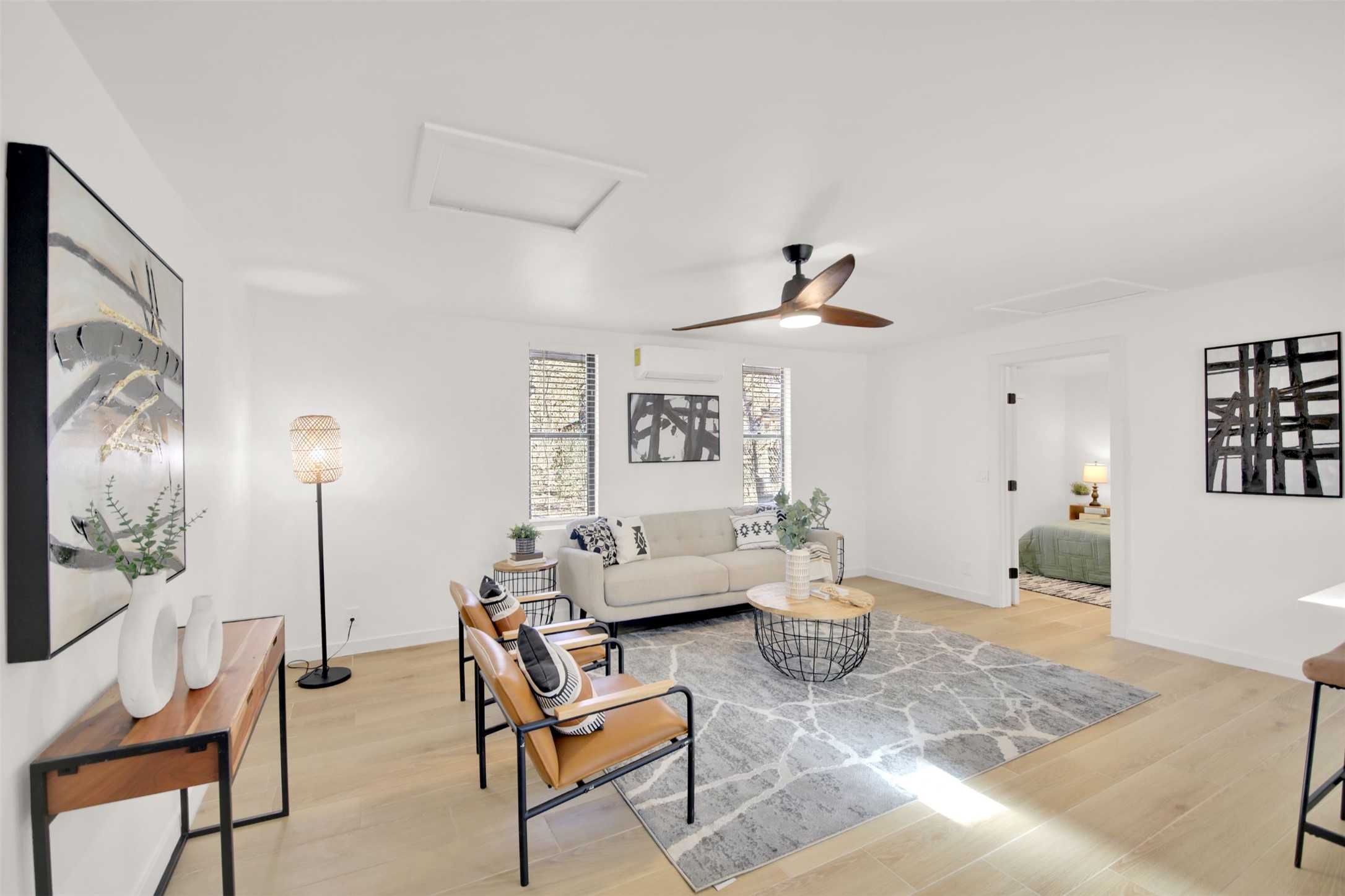 8904 Chisholm Lane Austin, TX 78748 - Photo 8 of 40 Living area featuring attic access, light wood-type flooring, and a ceiling fan