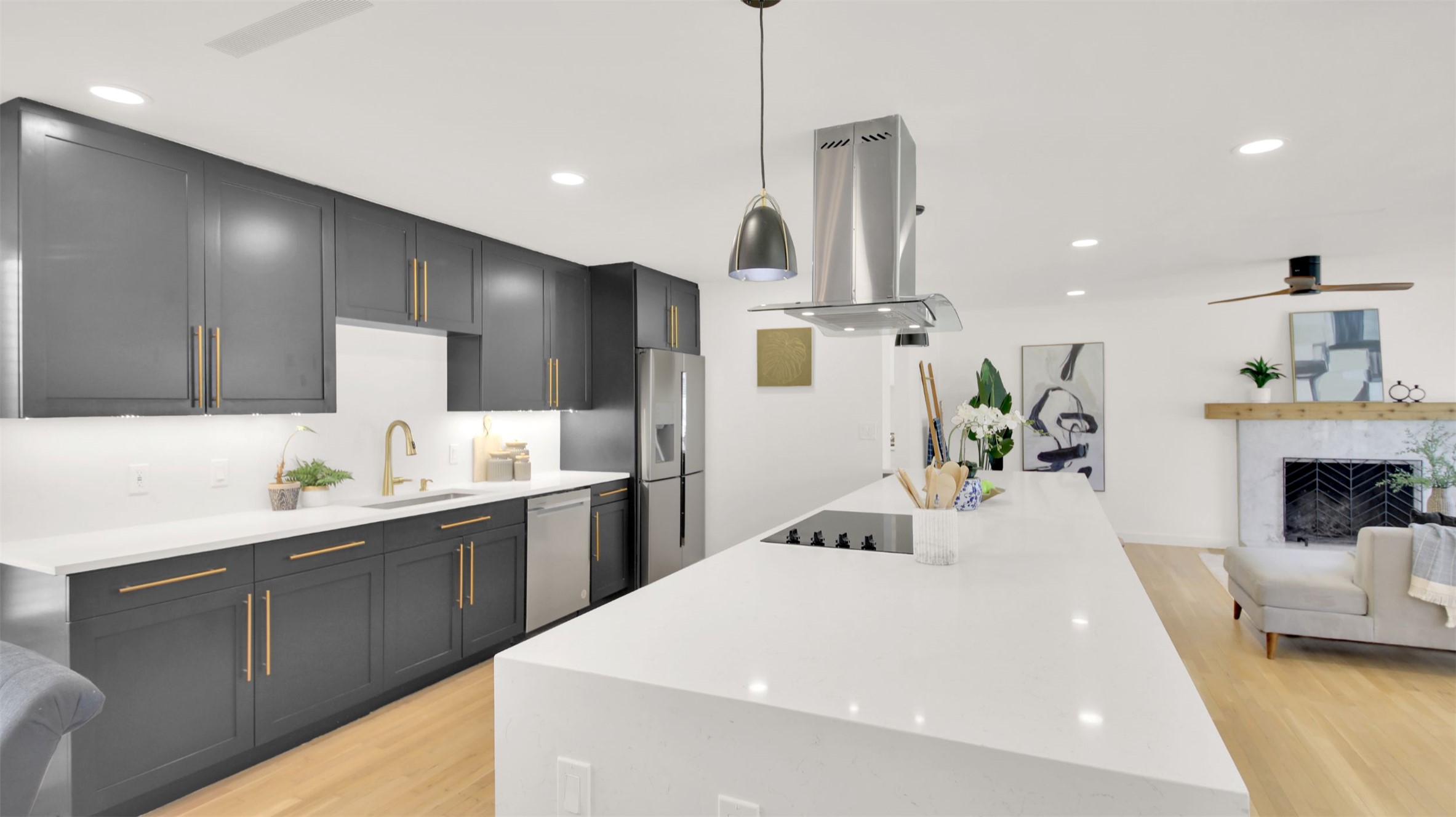 8904 Chisholm Lane Austin, TX 78748 - Photo 38 of 40 Kitchen featuring open floor plan, light stone countertops, recessed lighting, light wood-style floors, and a large island