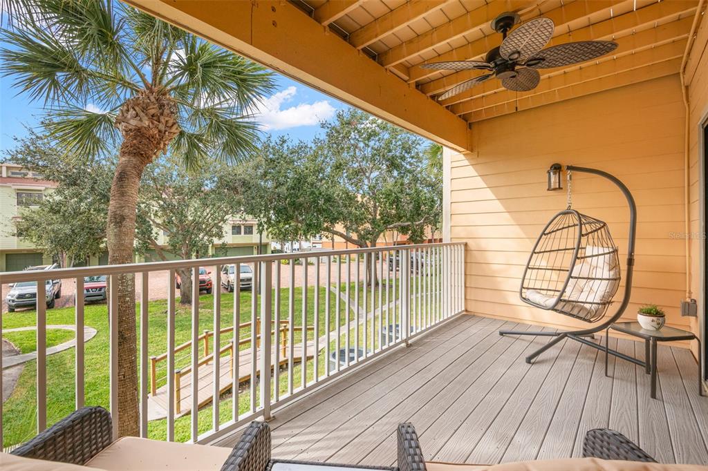 529 Sandy Hook Road Treasure Island, FL 33706 - Photo 20 of 55 a view of a balcony with wooden floor