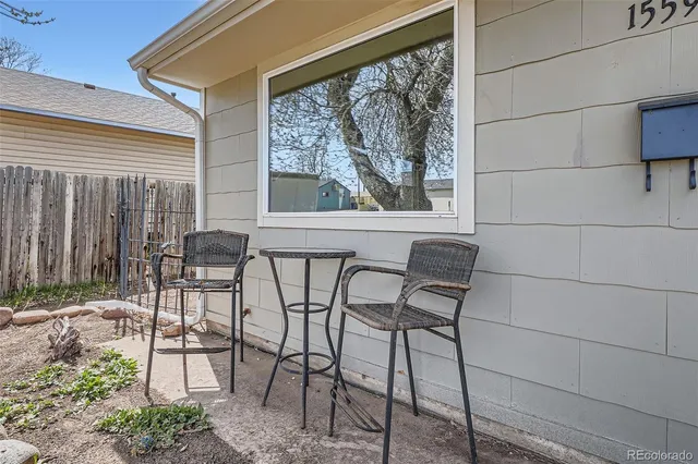 a view of a chairs and table in the patio