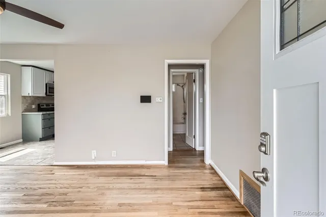 a view of a kitchen from the hallway