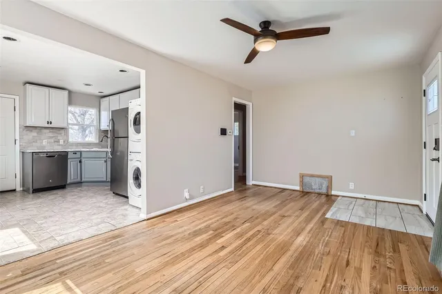 a view of kitchen with stainless steel appliances wooden floor