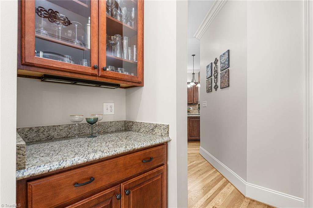 8404 Linville Oaks Drive Oak Ridge, NC 27310 - Photo 16 of 47 Butler's pantry between kitchen and dining room