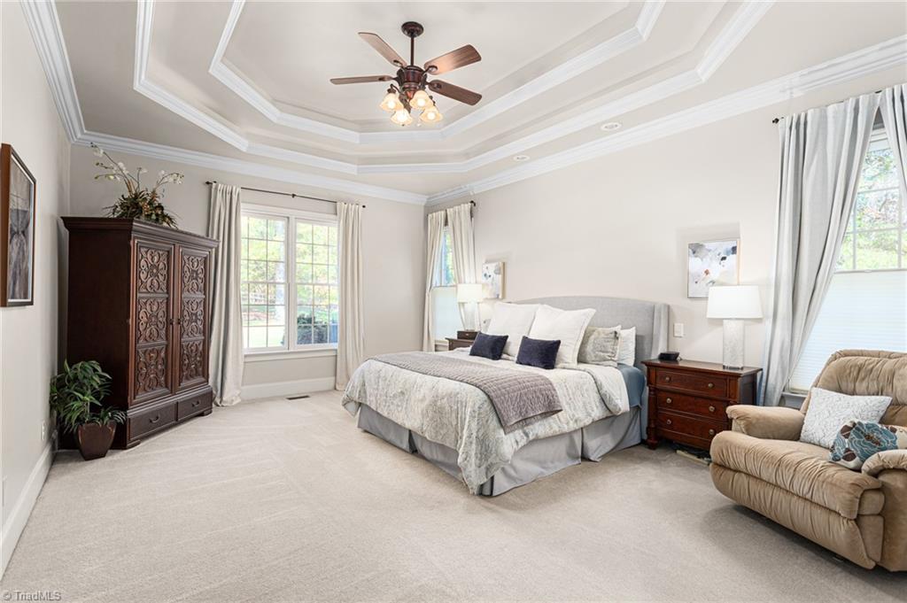 8404 Linville Oaks Drive Oak Ridge, NC 27310 - Photo 19 of 47 Spacious main level primary bedroom