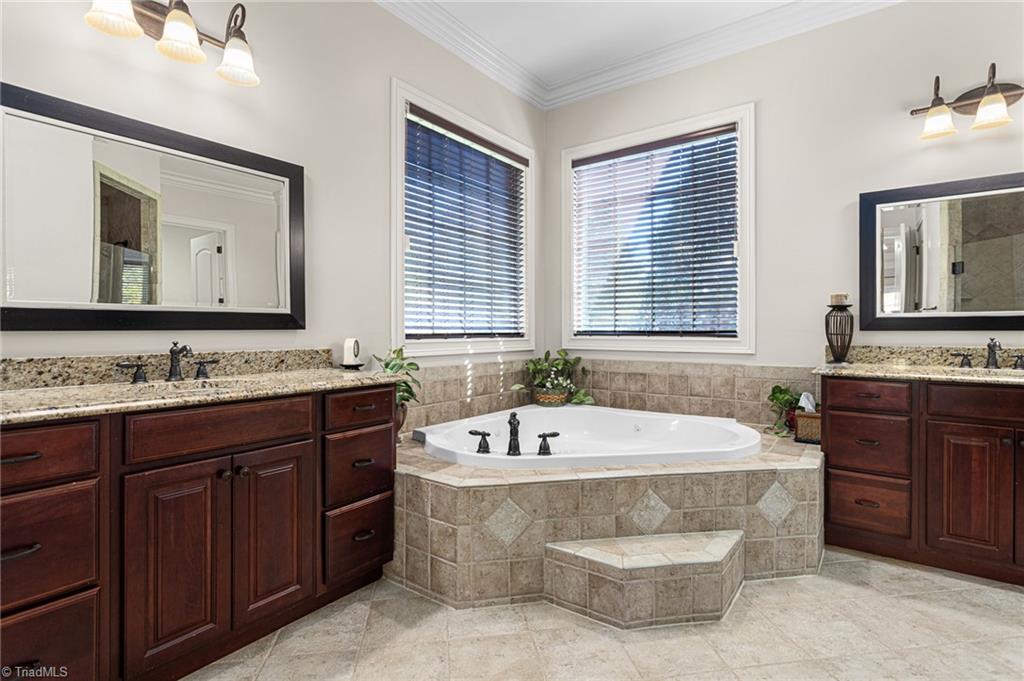 8404 Linville Oaks Drive Oak Ridge, NC 27310 - Photo 22 of 47 Ensuite primary bathroom