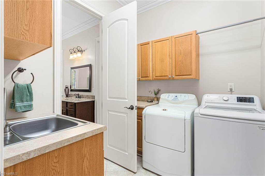 8404 Linville Oaks Drive Oak Ridge, NC 27310 - Photo 25 of 47 Laundry directly off primary closet