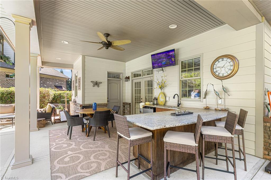 8404 Linville Oaks Drive Oak Ridge, NC 27310 - Photo 45 of 47 Gorgeous outside kitchen with leathered granite counters