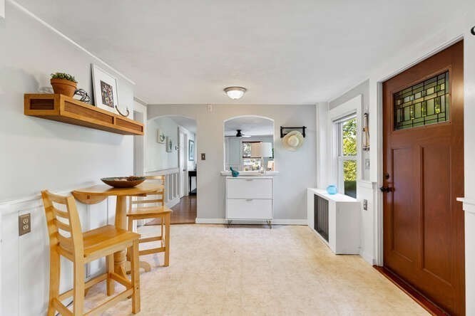 44 Cherry Street, Unit 2 Swampscott, MA 01907 - Photo 12 of 36 a living room with furniture and a refrigerator