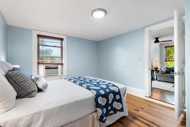 44 Cherry Street, Unit 2 Swampscott, MA 01907 - Photo 15 of 36 a bedroom with a bed and a window with balcony view