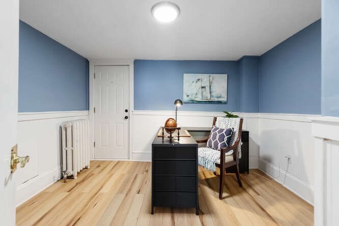 44 Cherry Street, Unit 2 Swampscott, MA 01907 - Photo 18 of 36 a bedroom with a bed and a chair