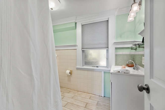 44 Cherry Street, Unit 2 Swampscott, MA 01907 - Photo 20 of 36 a bathroom with a sink and a mirror