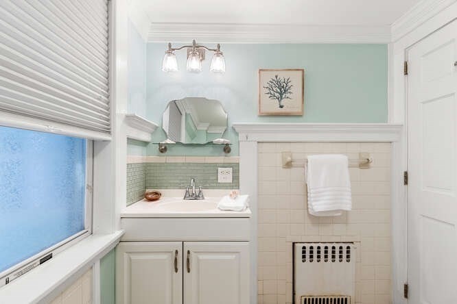 44 Cherry Street, Unit 2 Swampscott, MA 01907 - Photo 21 of 36 a bathroom with a sink and a mirror