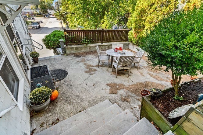 44 Cherry Street, Unit 2 Swampscott, MA 01907 - Photo 26 of 36 a backyard of a house with outdoor seating