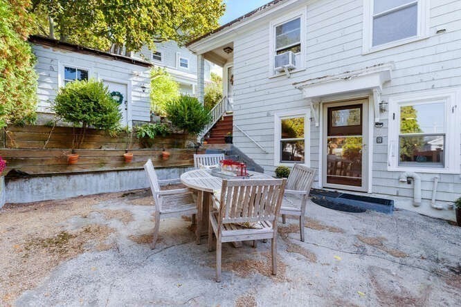 44 Cherry Street, Unit 2 Swampscott, MA 01907 - Photo 27 of 36 a backyard of a house with seating space