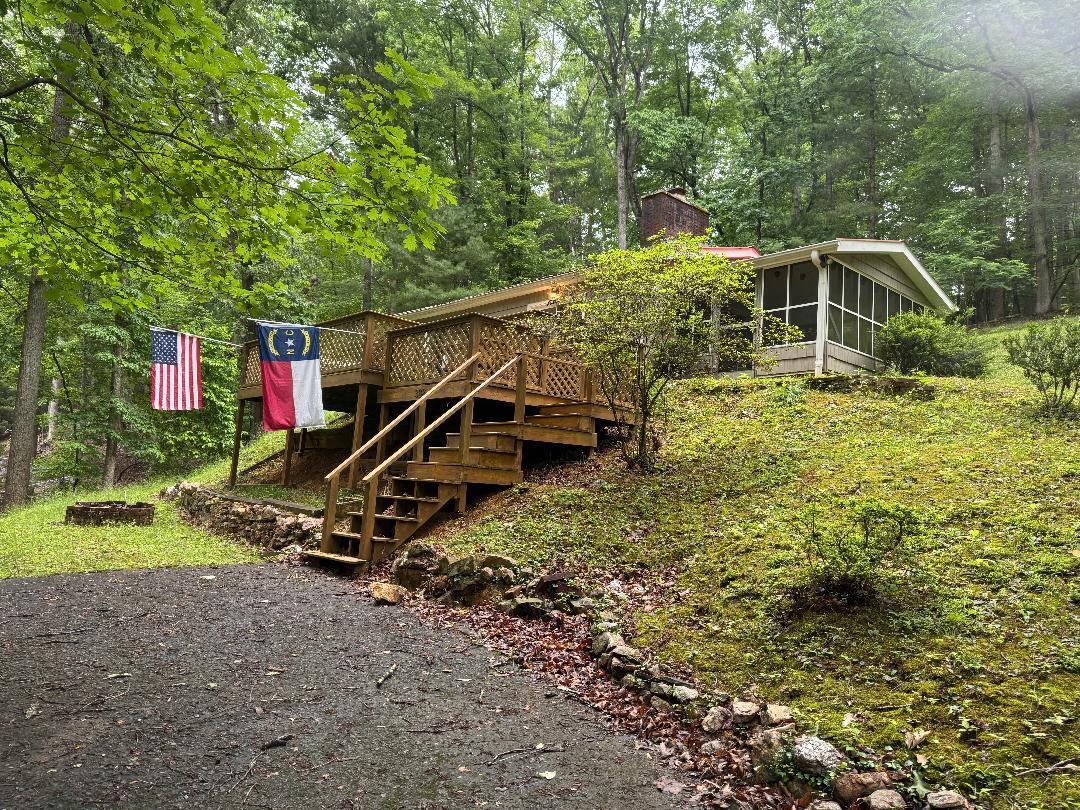 388 Salt House Branch Road Henry, VA 24102 - Photo 2 of 42 a house is sitting in middle of a park