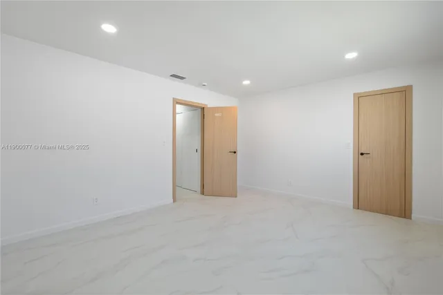 a bathroom with a toilet sink and shower