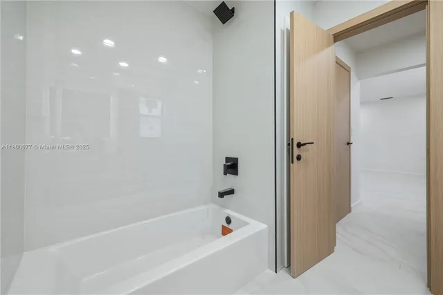 an empty room with a ceiling fan