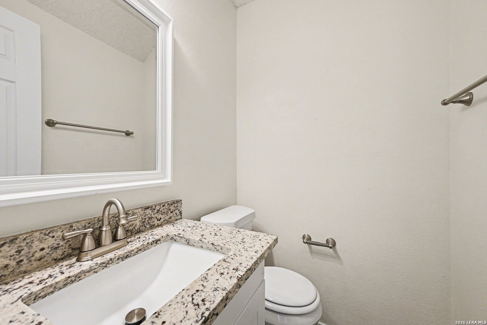 2407 Canyon Rim San Antonio, TX 78232 - Photo 16 of 30 a bathroom with a granite countertop sink mirror vanity and toilet
