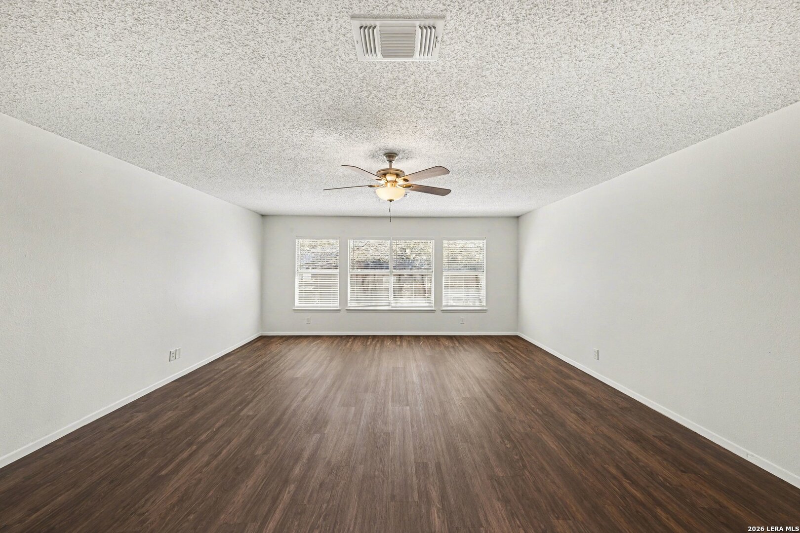 2407 Canyon Rim San Antonio, TX 78232 - Photo 18 of 30 wooden floor in an empty room with a window