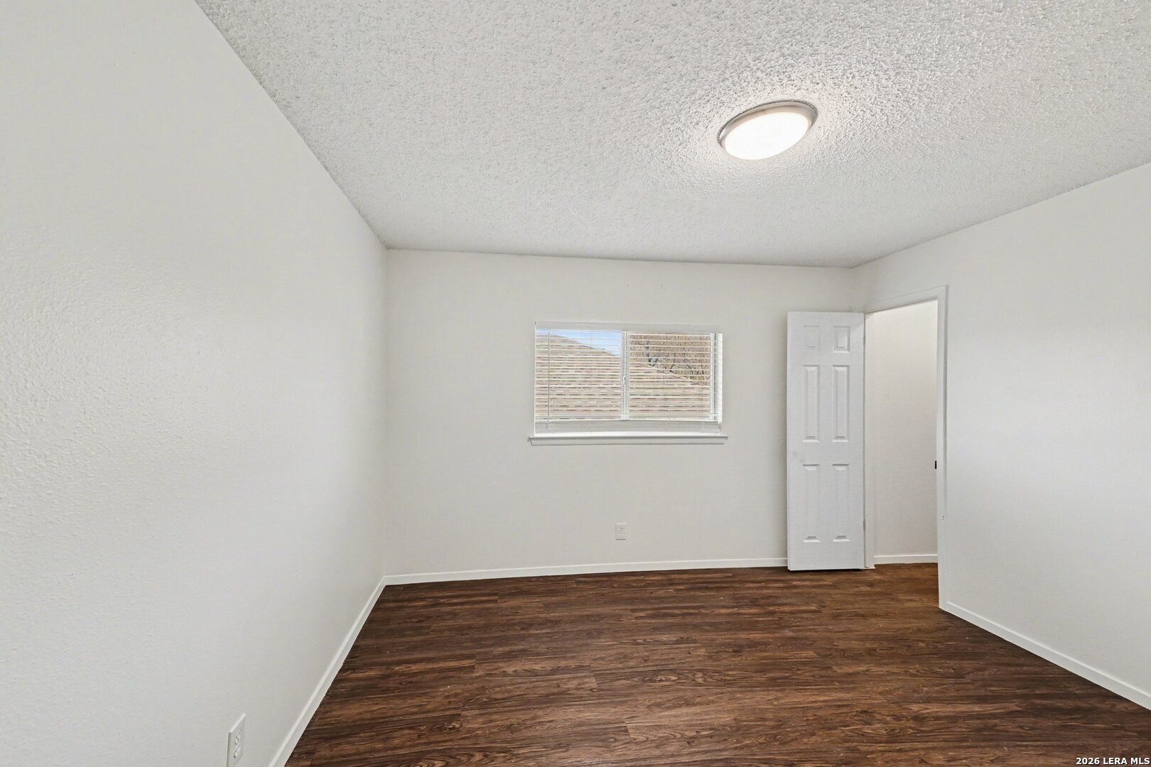2407 Canyon Rim San Antonio, TX 78232 - Photo 20 of 30 a view of an empty room with wooden floor and closet