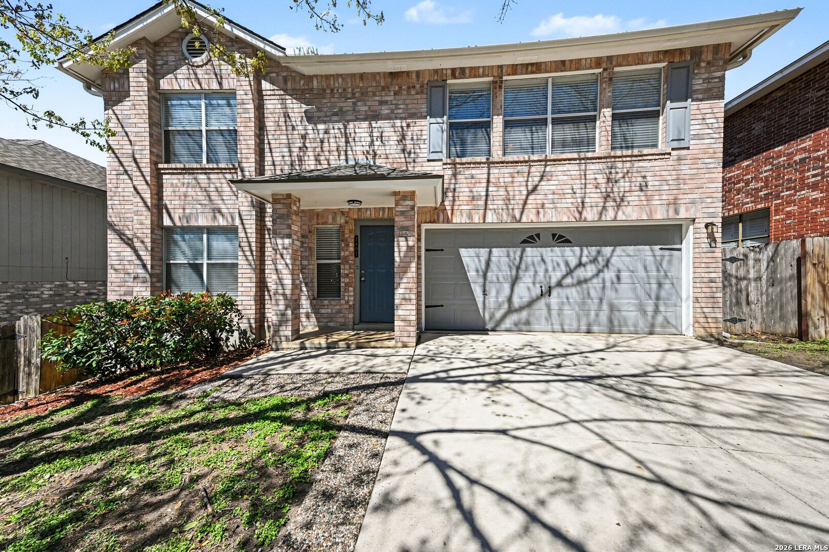 2407 Canyon Rim San Antonio, TX 78232 - Photo 2 of 30 a front view of a house with a garden