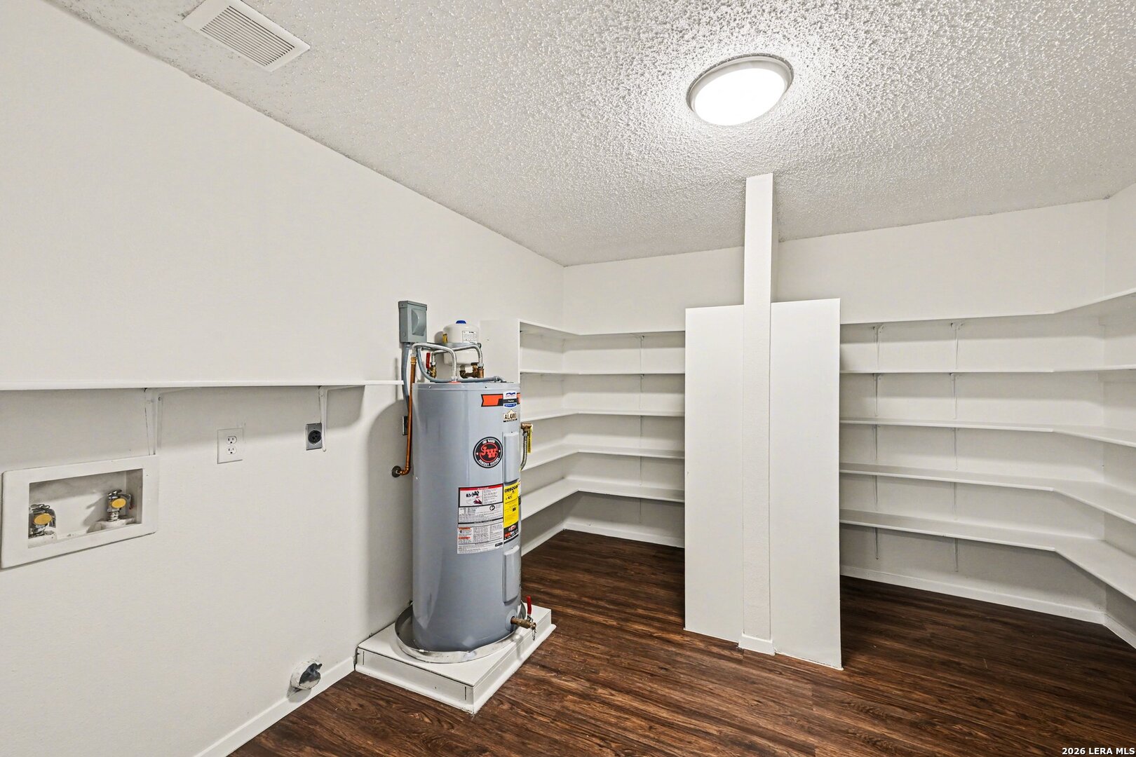 2407 Canyon Rim San Antonio, TX 78232 - Photo 25 of 30 a view of walk in closet with clothes and shoes
