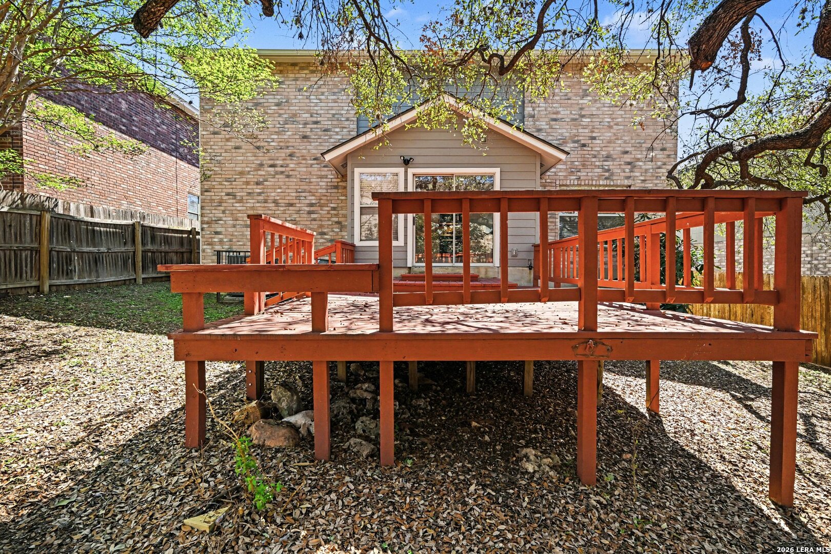 2407 Canyon Rim San Antonio, TX 78232 - Photo 28 of 30 a view of a wooden chairs and table in the backyard