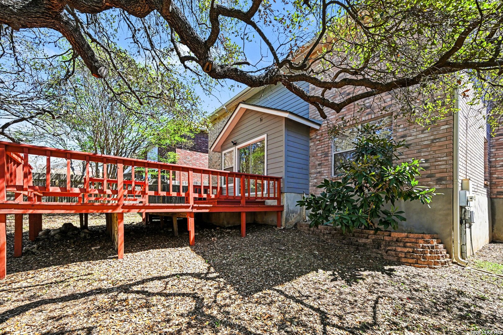 2407 Canyon Rim San Antonio, TX 78232 - Photo 30 of 30 a wooden bench sitting in front of a building