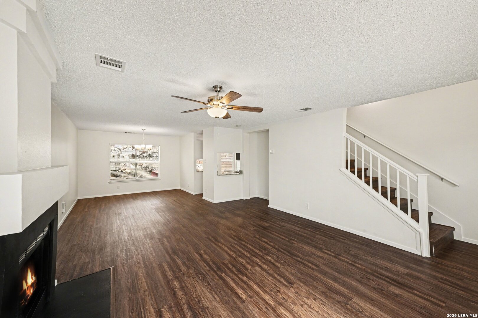 2407 Canyon Rim San Antonio, TX 78232 - Photo 5 of 30 a view of an empty room with wooden floor and fan