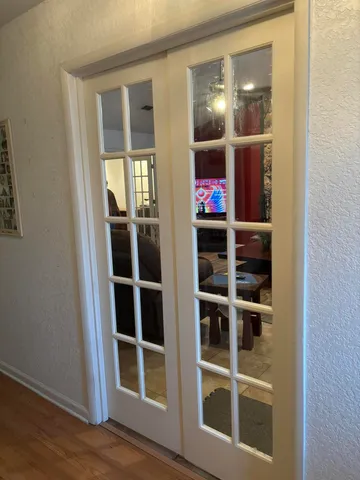 a view of an entryway with wooden floor