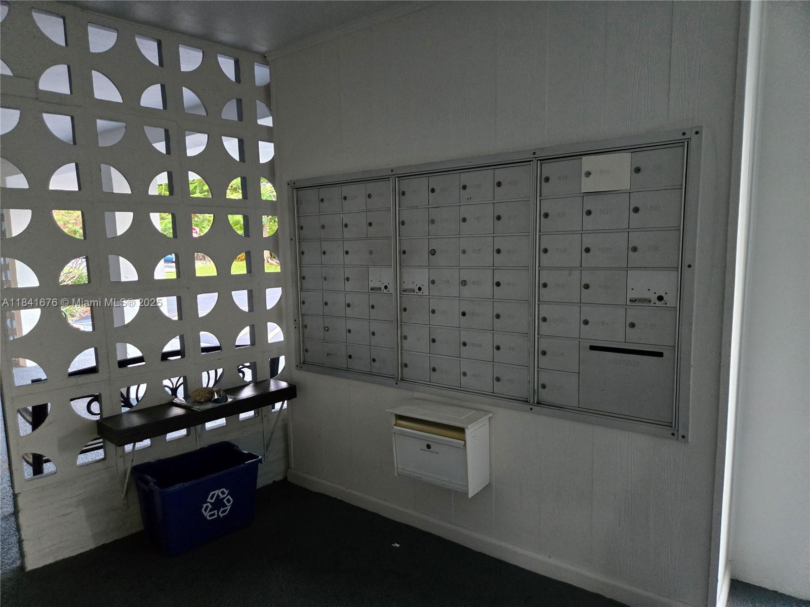 950 Hillcrest Drive, Unit 106 Hollywood, FL 33021 - Photo 30 of 30 a kitchen with a refrigerator and cabinets