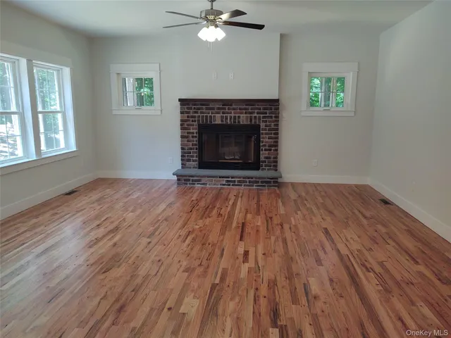 a kitchen with a sink a window stainless steel appliances and cabinets