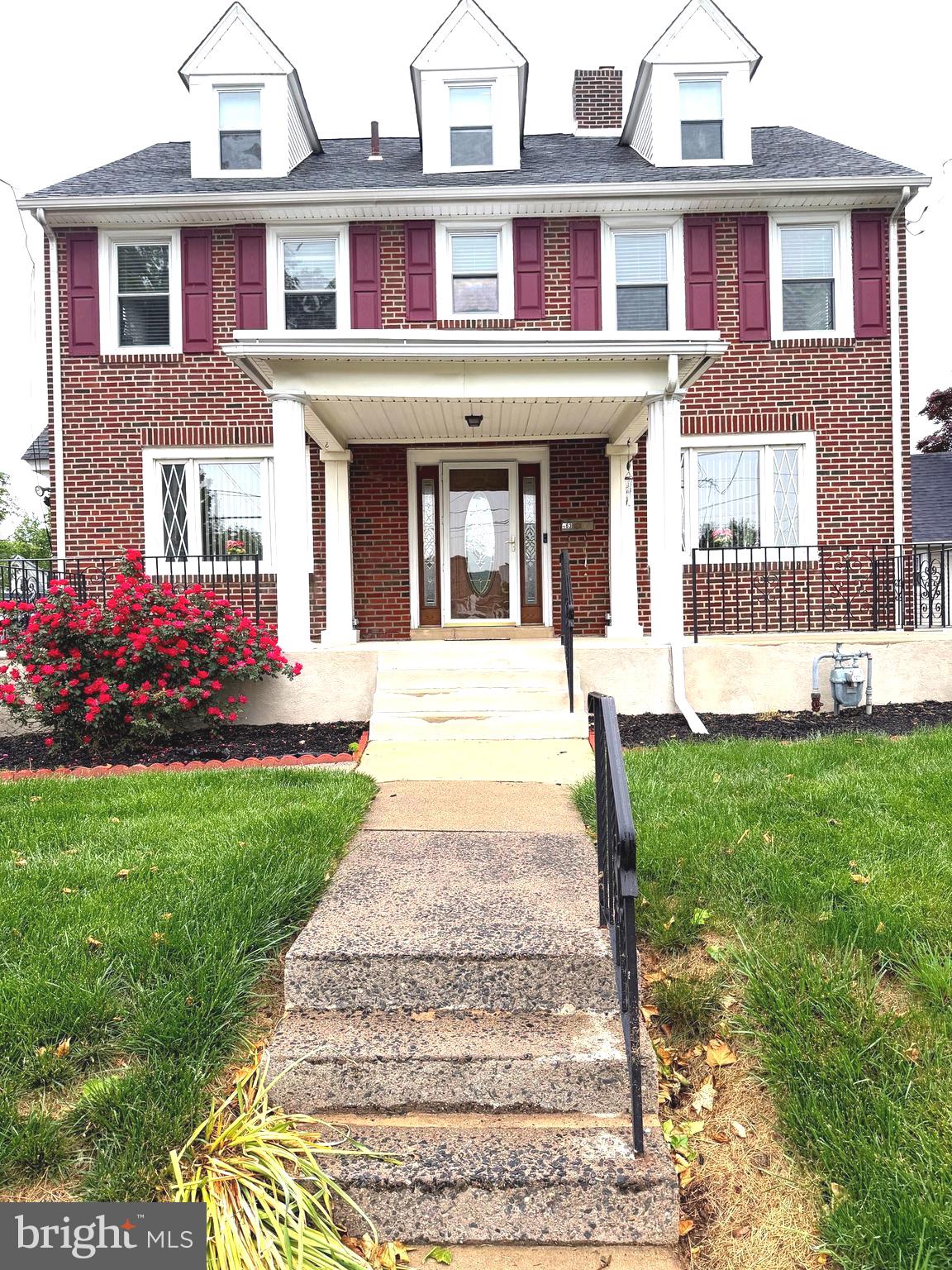 463 Burmont Road Drexel Hill, PA 19026 - Photo 1 of 39 front view of a brick house with a yard