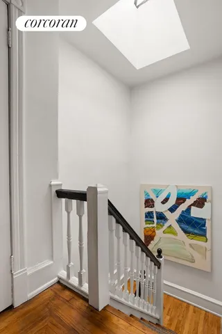 a view of an entryway with wooden floor