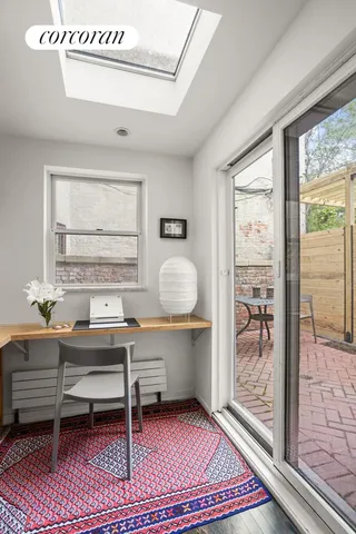 a workspace with furniture and window