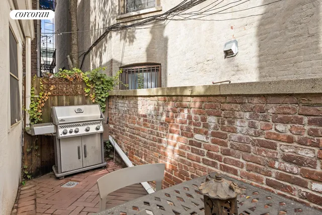 a bathroom with a sink a toilet and shower curtain