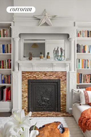 a living room with furniture and a fireplace