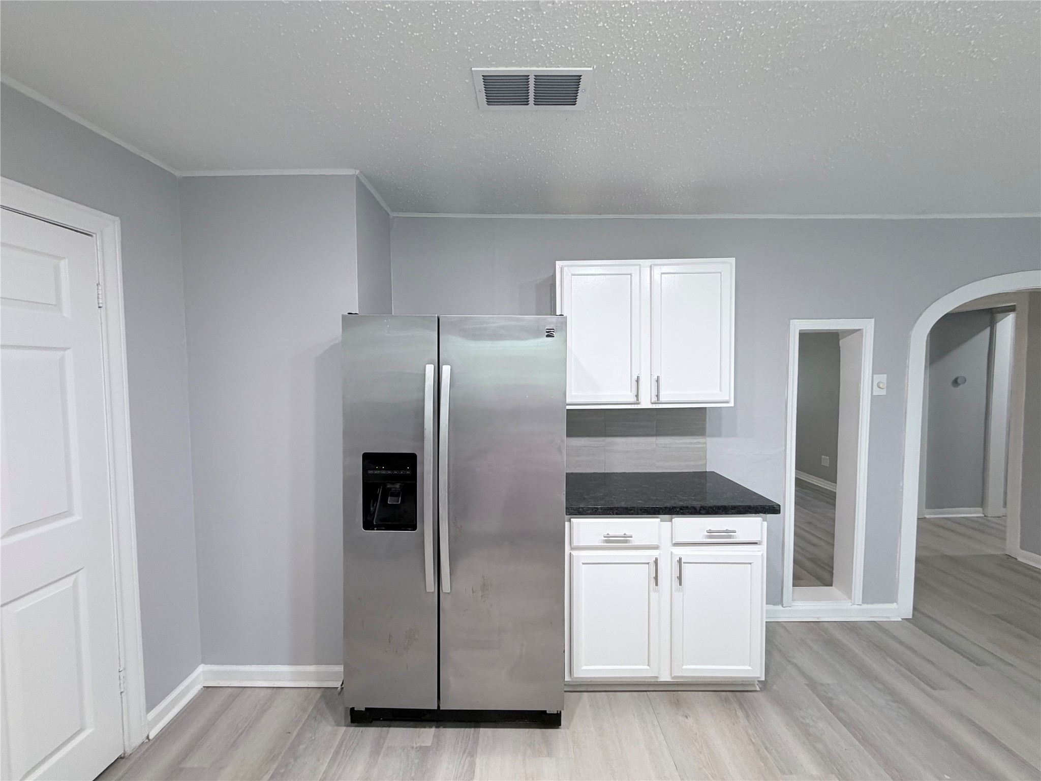 1903 Little Street La Marque, TX 77568 - Photo 11 of 18 a kitchen with granite countertop a refrigerator and a stove top oven