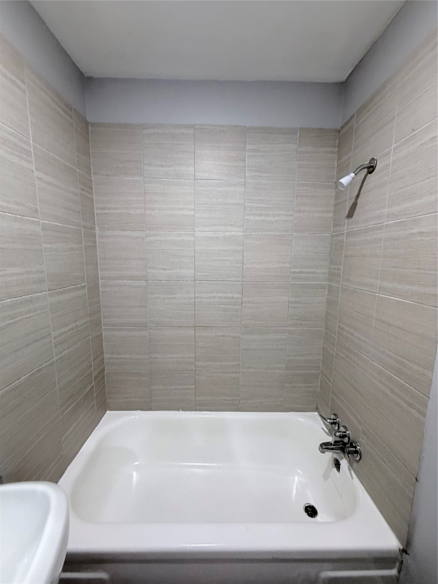 1903 Little Street La Marque, TX 77568 - Photo 14 of 18 a bathroom with a bathtub